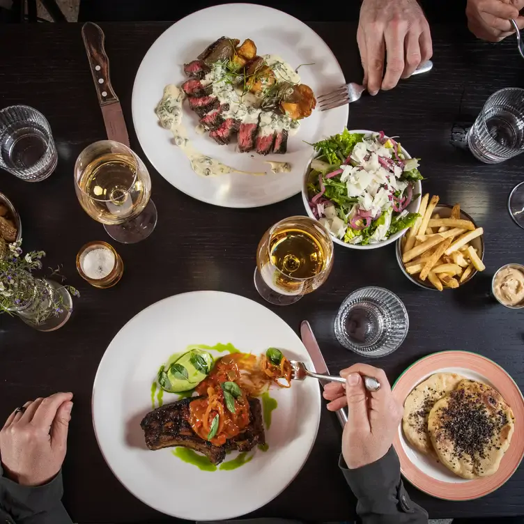 Diners enjoying steaks at Lottie’s, one of the best lunch restaurants in Dublin.