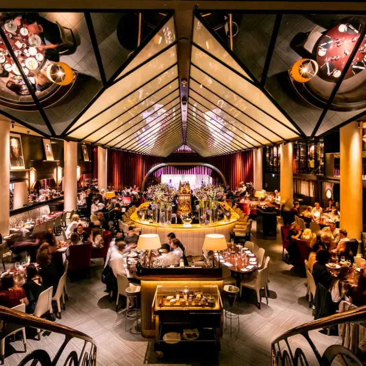 The stylish interior of the dining room at Quaglino’s, one of the best live music restaurants in London.