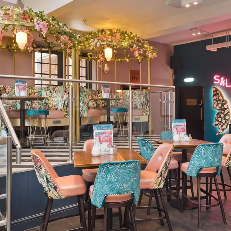 Colourful tables with fairy lights and foliage at the Slug and Lettuce Harborne.