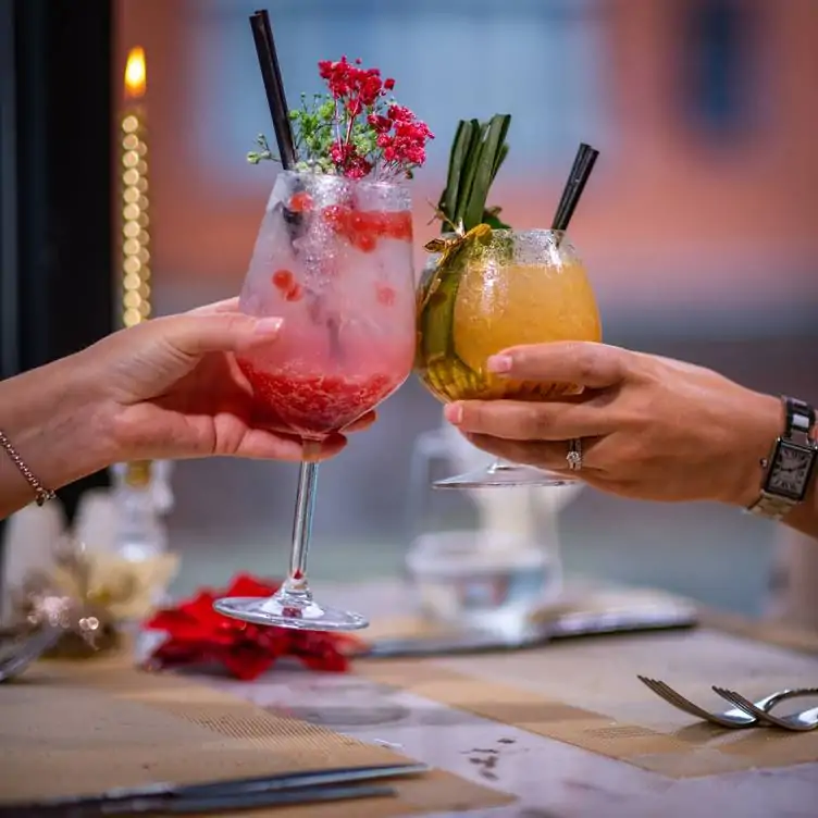 Cocktails garnished with flowers at Noel’s Bar and Restaurant, one of the best bottomless brunches in Birmingham.