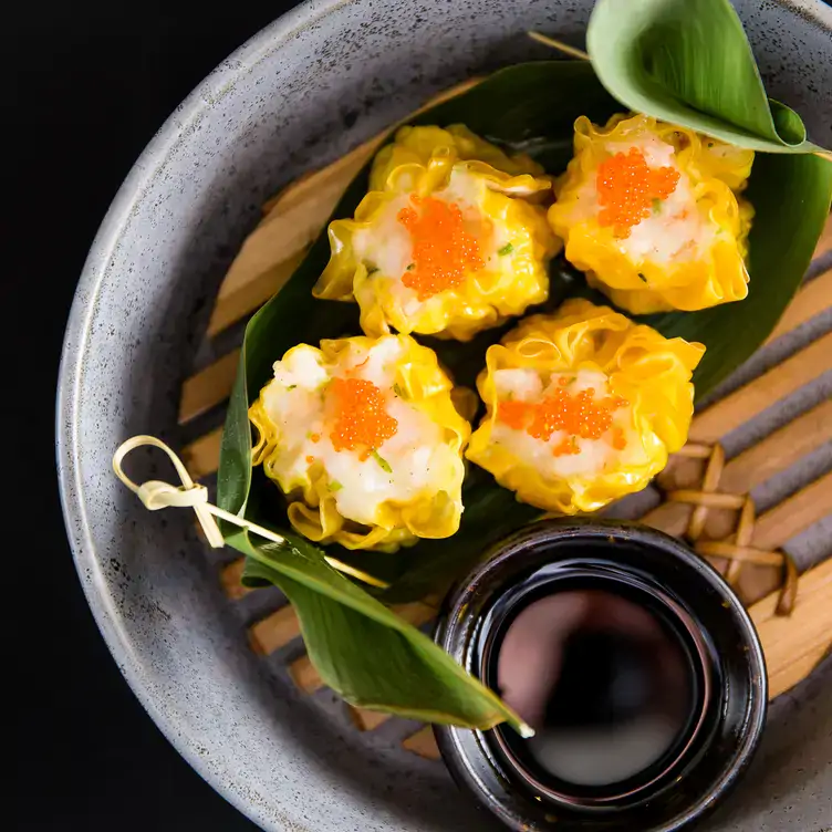 A colourful dumpling dish with soy sauce at Thai Square, one of the best riverside restaurants in London.