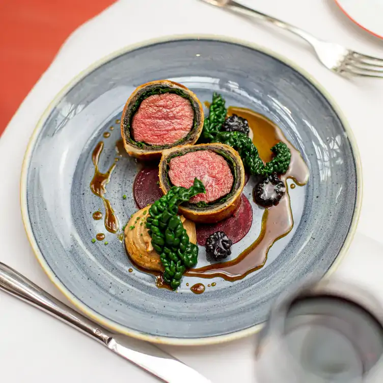 A beef wellington dish at Bluebird Chelsea Restaurant, one of the best restaurants in Chelsea, London.