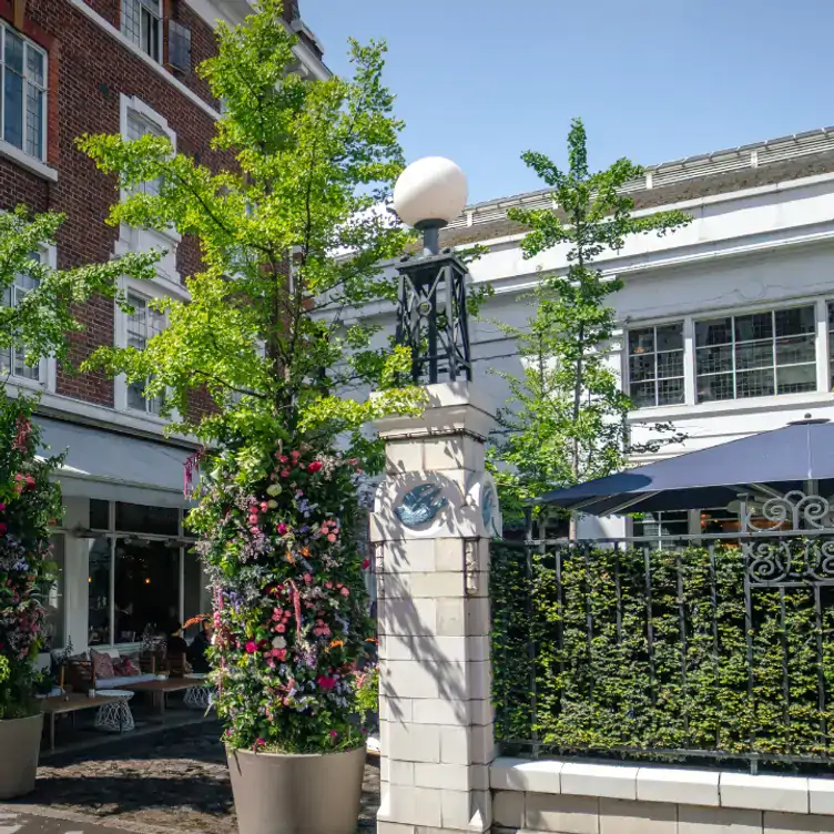 The Art Deco style exterior and gated entrance at Bluebird Chelsea Restaurant, one of the best restaurants in Chelsea, London.