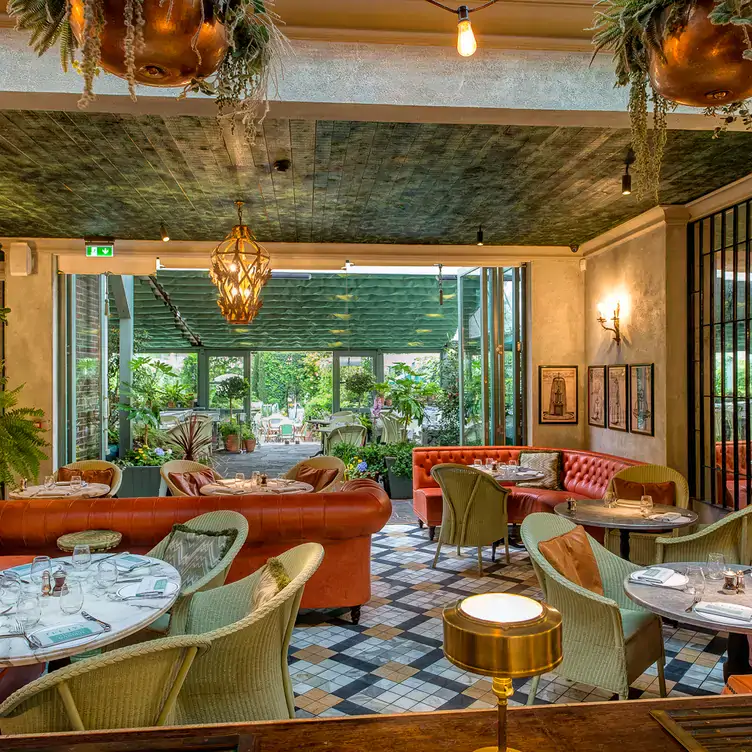 The elegant and lavish dining room and outdoor patio at The Ivy Chelsea Garden is a prime location for a special occasion. Credit: The Ivy Chelsea Garden