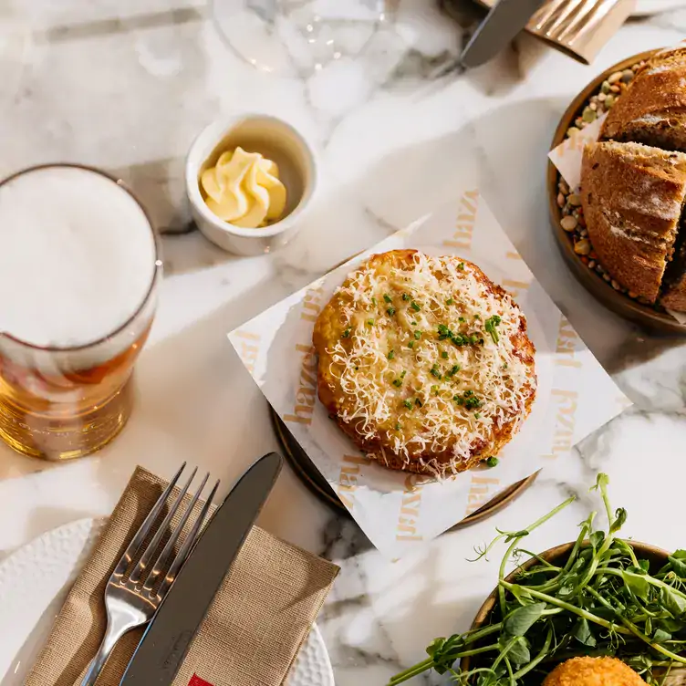 A cheese pastry and a pint of beer at Hazel, one of the best restaurants in Glasgow