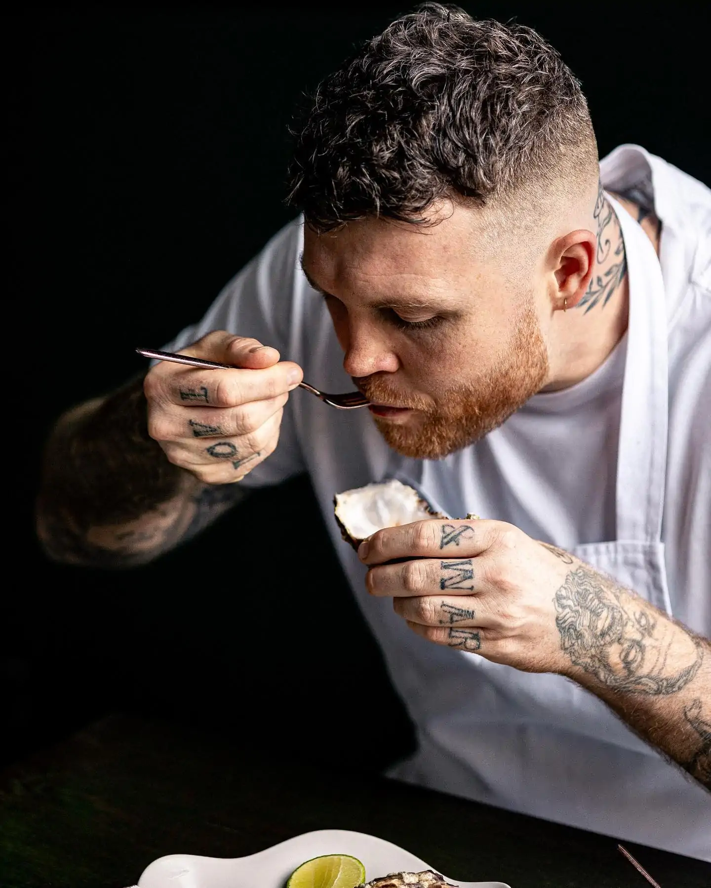 Chef Tom Brown eats an oyster at Pearly Queen, one of the best oyster restaurants in London.