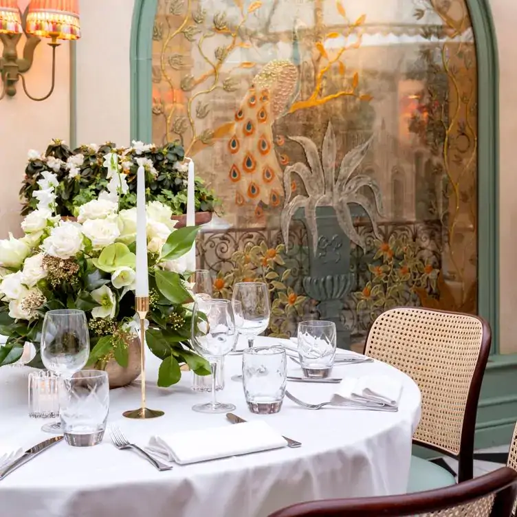 A table set for service in the conservatory of Daphne’s, one of the best restaurants for private dining in London.