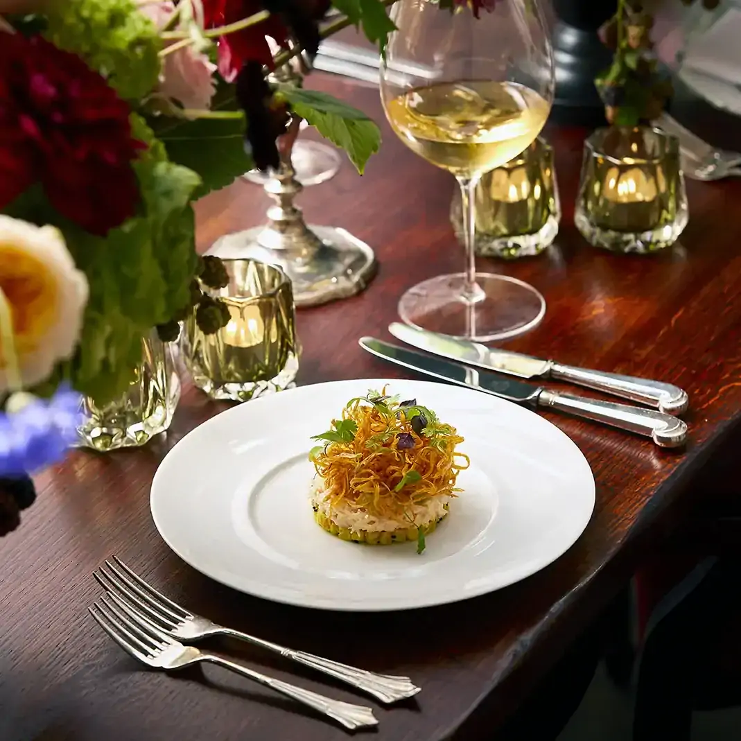 A fancy appetizer and wine from the Christmas menu at The Lanesborough, one of the most festive restaurants in the UK.