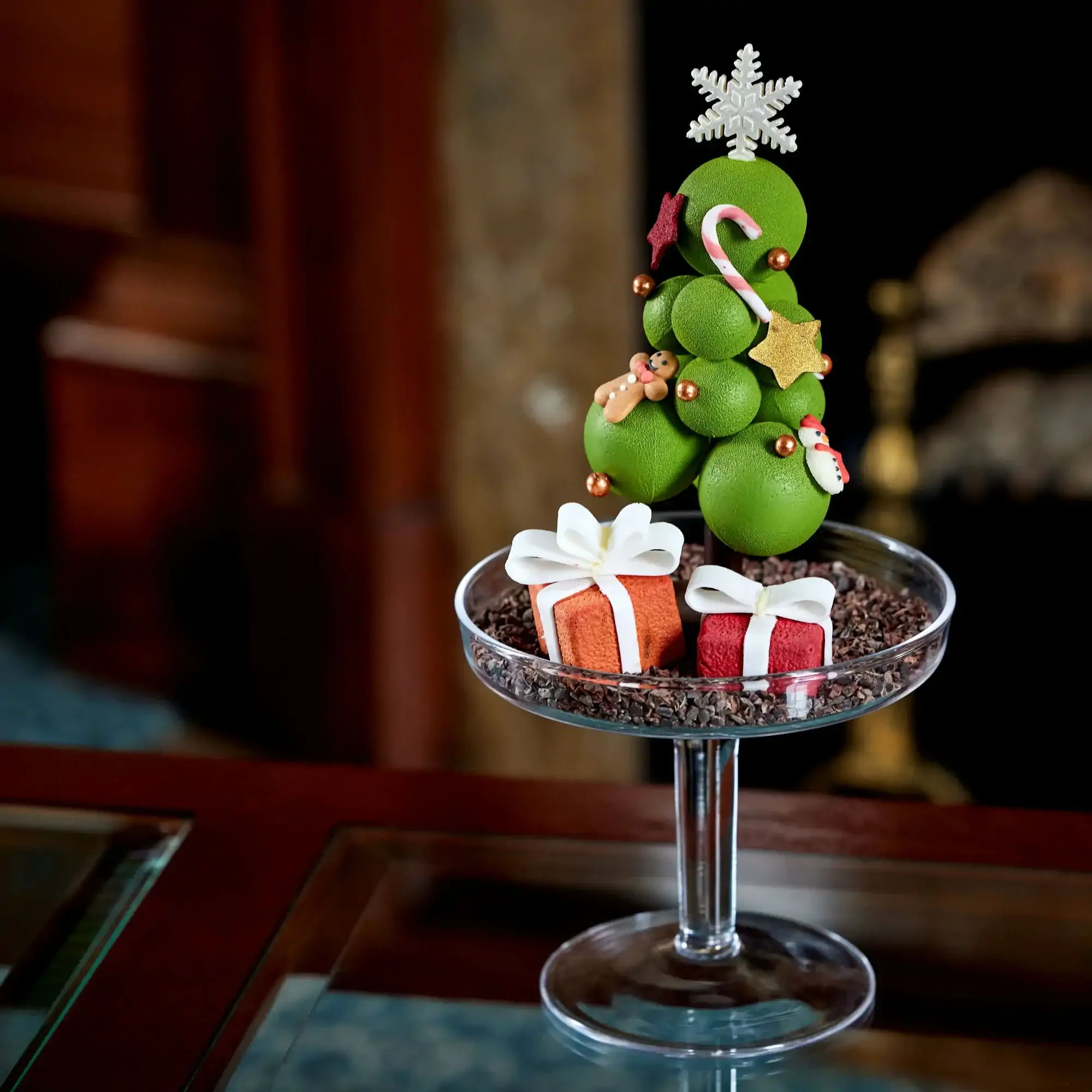 A cocktail glass with Christmas decorations at The Lanesborough, one of the most festive restaurants in the UK.