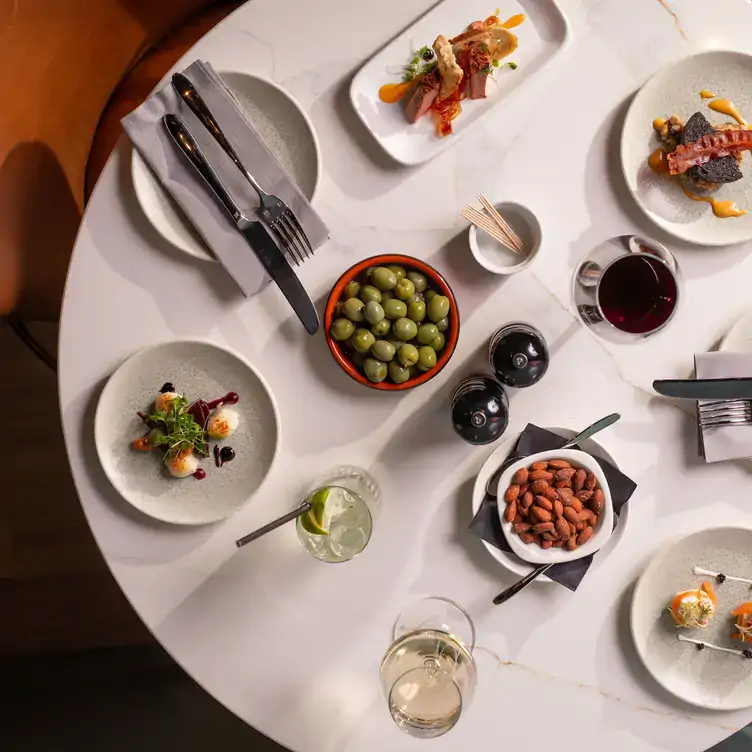 A bird eye view of a dining table with food and wine at North at The Address Hotel in Glasgow