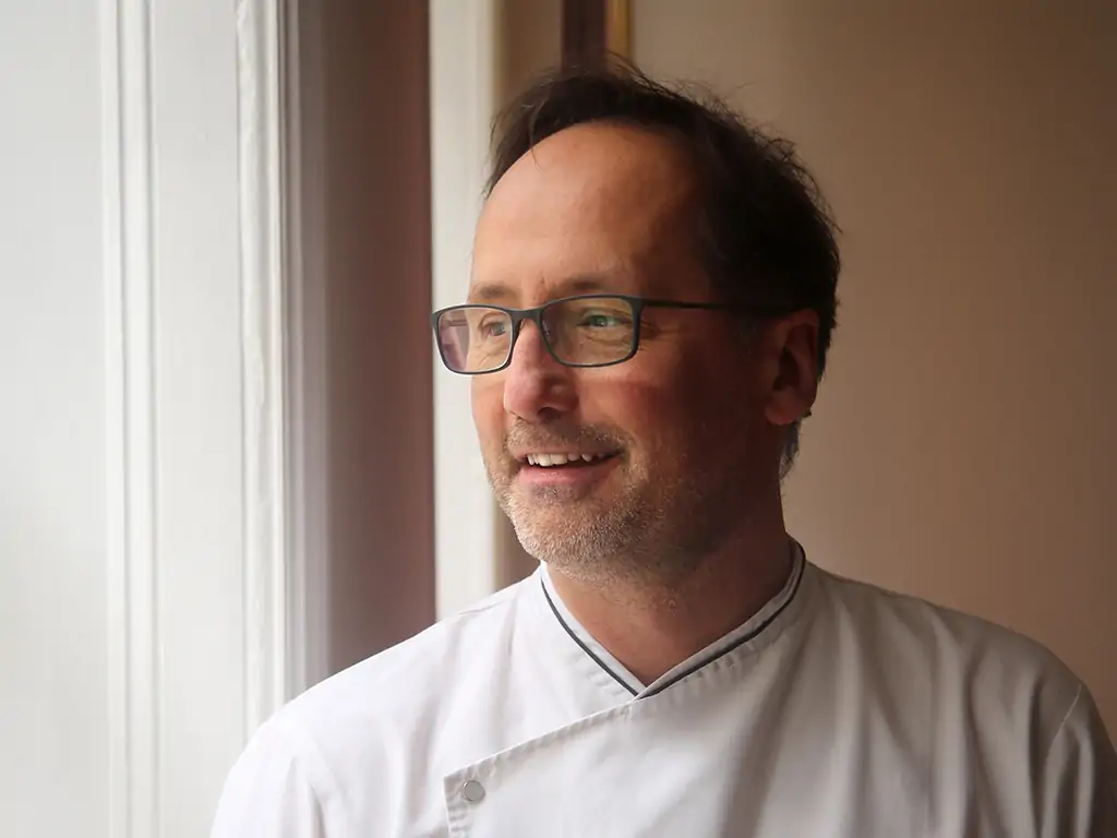 A headshot of MICHELIN-starred chef Alexis Gauthier, one of the best vegan chefs in the world