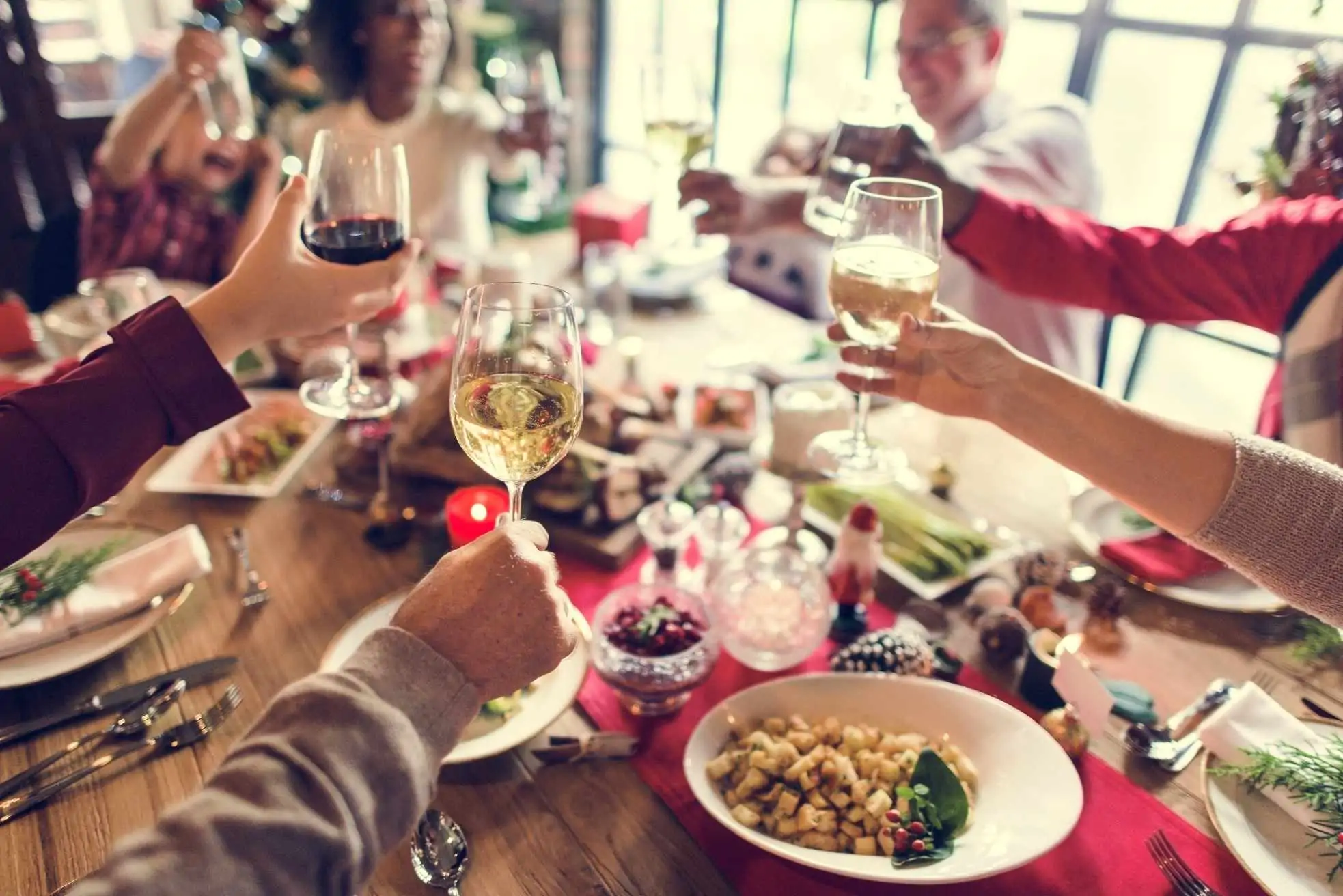 group of people celebrating with drinks toast