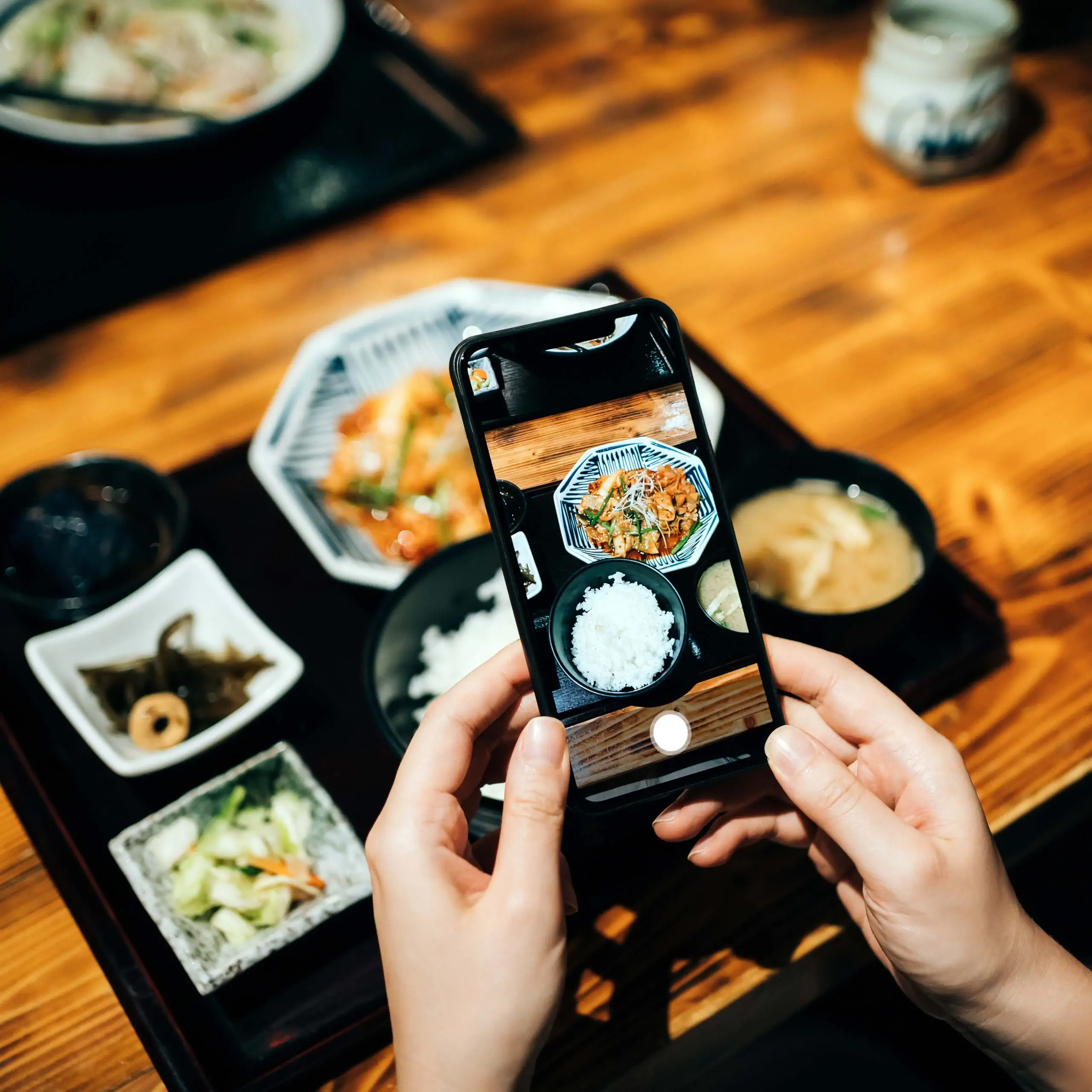 taking a picture of food for social media