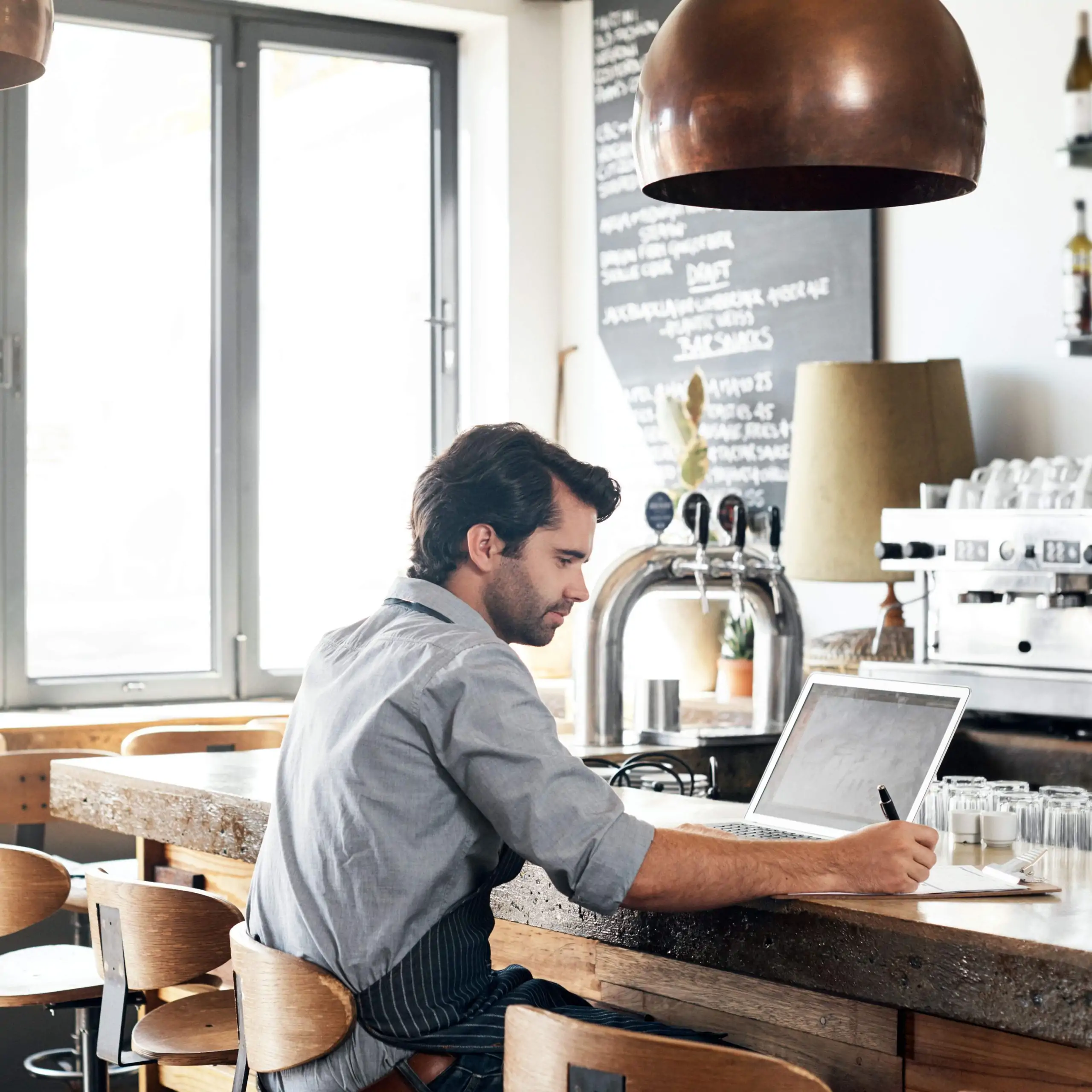 Restaurant staff working on their laptop