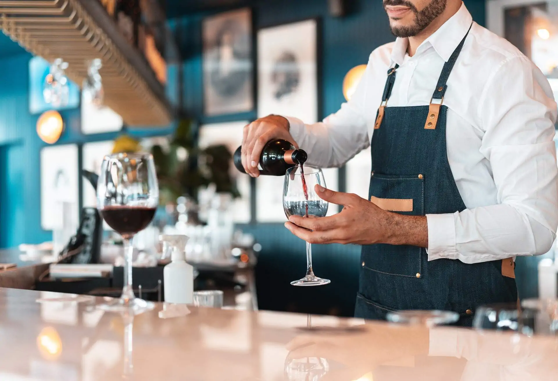 Bartender pouring drinks at a bar or restaurant