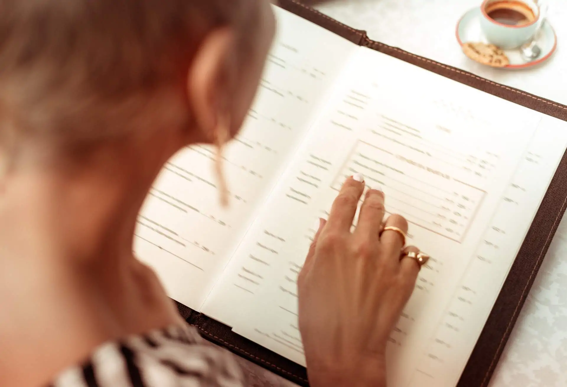 woman reading a menu