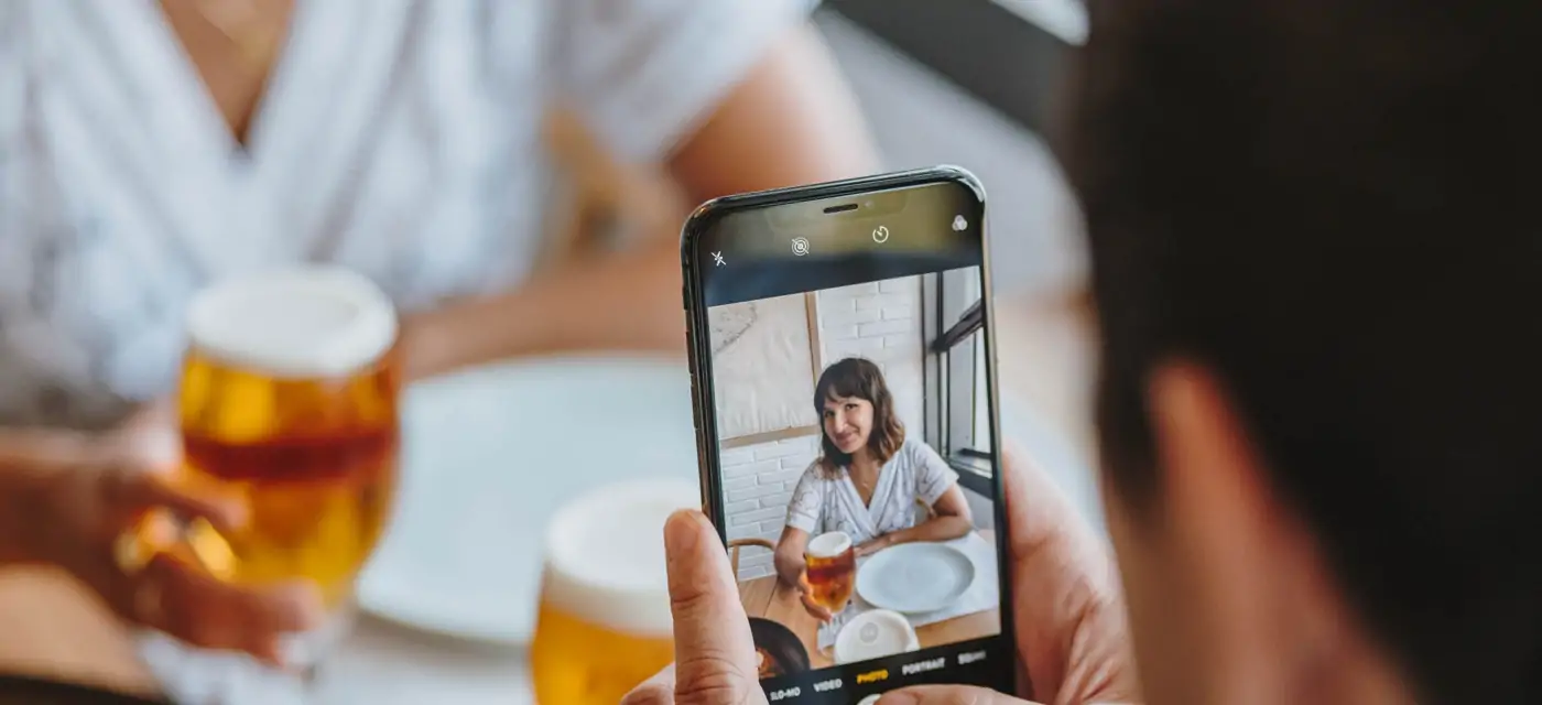 customers are restaurant taking picture with mobile phone